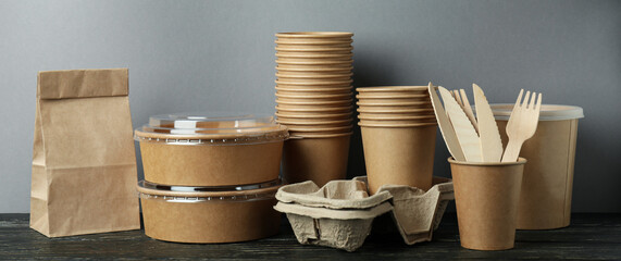 Delivery containers for takeaway food on wooden table
