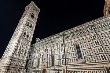 The side facade of the Florence Cathedral, Duomo of Santa Maria del Fiore and bell tower of Giotto di Bondone (Campanile). UNESCO world heritage site, Piazza del Duomo, Tuscany, Italy, Europe.