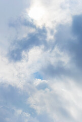 The gloomy sky is covered with clouds of different shapes and colors