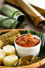 Glutinous rice is wrapped with lerek or banana leaf encased in bamboo culm and cooked in open fire / Lemang / A must have in every traditional Malay household, eaten with beef or chicken rendang
