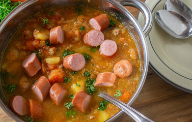 Carrot stew with minced meat, root vegetable and vienna sausage