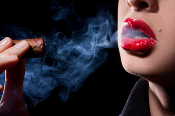 Young girl smoking cigar