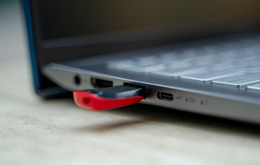 USB flash drive plugged in laptop.