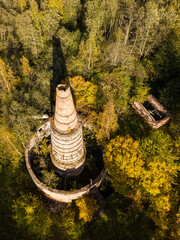 Abandoned lime kiln tower in sunny autumn day, Latvia.