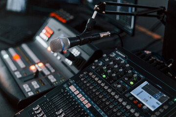 Close up view of radio mixing desk with professional sound equipment