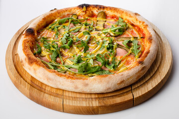 Top view of hot pizza on a wooden stand.