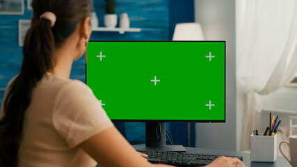 Woman sitting at office desk and searching on internet for commerce business using computer with...