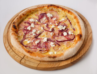 Top view of hot pizza on a wooden stand.
