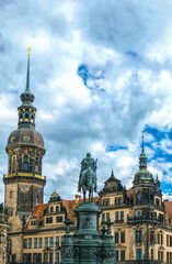 Fototapeta na wymiar Dresden, Germany - May 02 2019: statue of the Saxon King Johann at the facade of the Semper Opera, and the royal palace-residence, sculptor - Johannes Schilling, installed in 1889 on the Theaterplatz