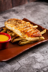 Chicken steak. Served with honey-mustard sauce.