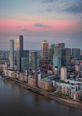 Fototapeta na wymiar The modern skyscrapers of Canary Wharf in London, United Kingdom, during sunset time