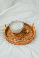 Breakfast in bed, cappuccino, wicker tray, spring, home decor. Cozy.