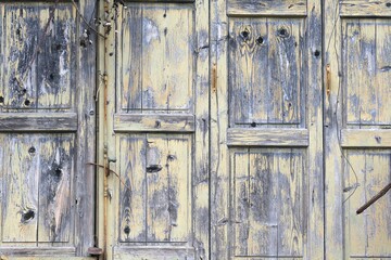 old wooden planks and shutters in an abandoned and dilapidated hut in the Tuscan countryside in Italy