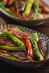 Delicious spicy homemade stir-fried Chinese smoked sausage with asparagus.
