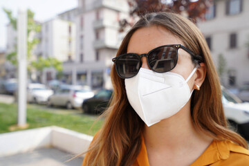 Close up of business woman in protective face mask FFP2 KN95 outdoors
