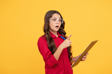 in a process. surprised kid in protective glasses. childhood. teen girl wear eyeglasses.