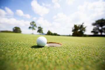Golf ball on the green grass in beautiful golf course. happy golf game