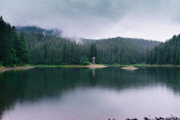 Mountain Lake at Fog Rainy Day