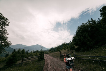 People Hiking Mountain Trail Path at Foggy Day