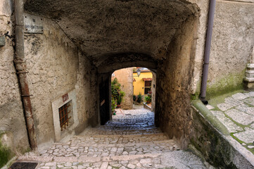Fototapeta na wymiar Guardia Sanframondi, Italy, alleys between the old houses of a medieval village in the province of Benevento, Italy. 