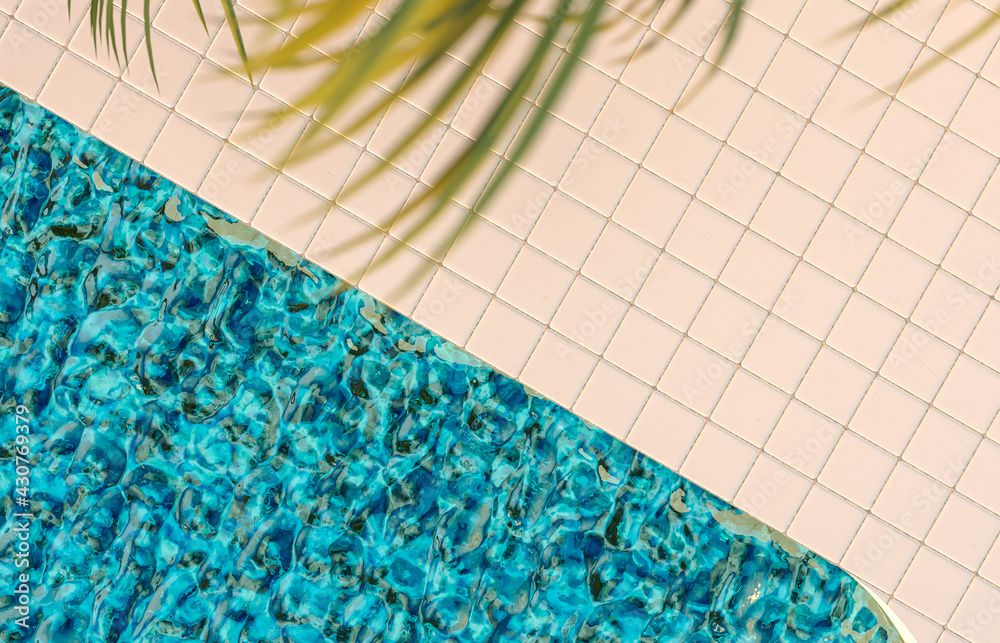 Poster summer pool scene background with white tiles floor and palm leaves.