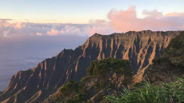 Kalalau valley lookout at sunset pink clouds timelapse