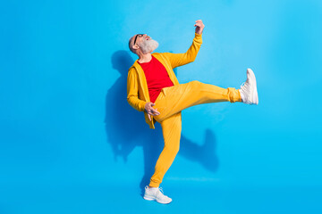 Full size photo of happy excited crazy cheerful grandfather playing invisible guitar isolated on...