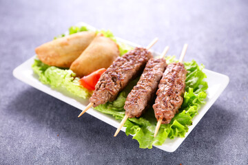 grilled beef kebab and lettuce