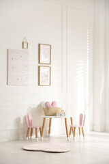 Baby room interior with stylish furniture and toys