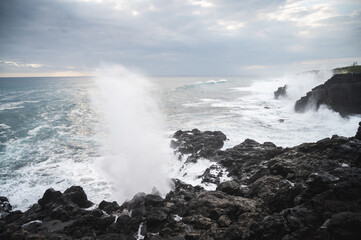 waves crashing on rocks