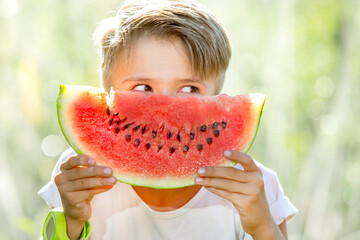 happy child eating watermelon - Powered by Adobe