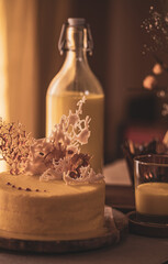 Delicious white and yellow minimalist decorated cakes, coffee milk beverages and liquor
