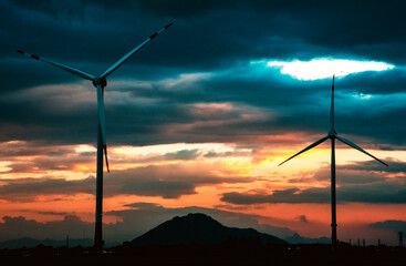 Obraz premium Wind Turbine Tower At Dusk Aerial Drone View - Sustainable Investment