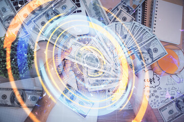 Multi exposure of Tech drawing hologram and USA dollars bills and man hands. Technology concept.
