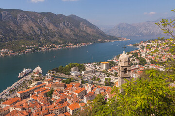 Naklejka na ściany i meble Wonderful view of the bell tower of the Church of Our Lady of Remedy standing on a hill in the town of Kotor. Montenegro 
