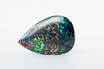 Mined from Queensland fields solid black matrix boulder opal. Red, orange, green, yellow, amber,...