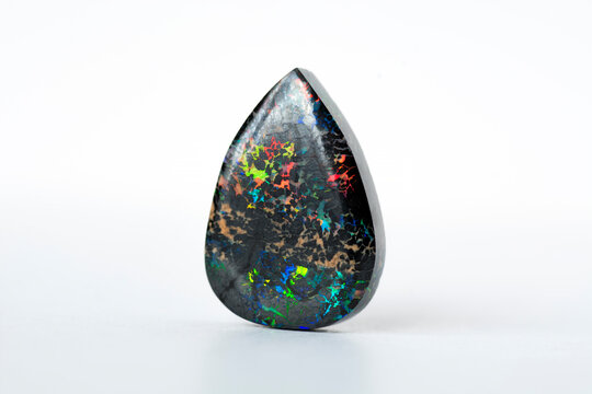 Mined from Queensland fields solid black matrix boulder opal. Red, orange, green, yellow, amber, violet and turquoise color veins play. Ironstone treated, carbonated  to darken and stabilized. 