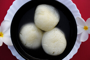 Traditional popular Indian sweet dish big size Rasgulla or rosogula , Bengali syrupy dessert sweets.