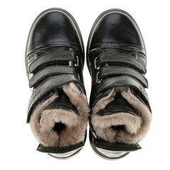 Top view of children's warm leather boots isolated on a white background.