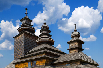 closeup wooden christian church on blue sky background