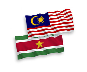 Flags of Republic of Suriname and Malaysia on a white background