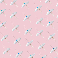 Pattern vaccine with wings. Vaccination during a pandemic. Minimal composition. Pink wallpaper.