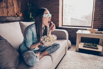 Full body profile side photo of shocked young lady watch tv eat pop corn wear 3d glasses indoors...