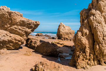 Fototapeta na wymiar Matador beach and beautiful landscape with rocks and ocean against blue sky, California