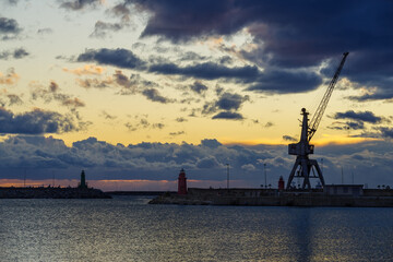 Fototapeta na wymiar Stormy clouds about the Imperia Oneglia harbour in evening, Italy