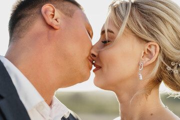 Portrait of a bride and groom in a sunset light