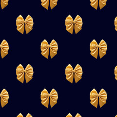 Seamless pattern Gift Satin golden Bow on dark blue background.. Pattern for fabric print, wrapping paper design. Birthday, New Year and Christmas background. Holiday design