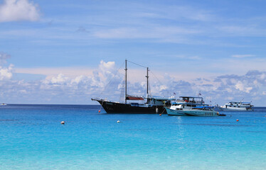 ship and yachts in the azure sea