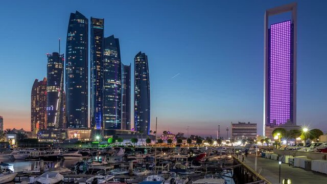 Al Bateen marina Abu Dhabi day to night timelapse with modern skyscrapers on background