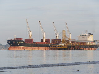 April 14 2021 - Krabi, Thailand : Logistics and transportation of International Container Cargo ships in the sea.